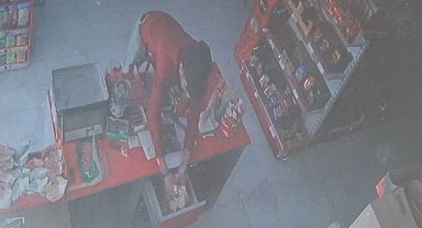 Önce kasasını soydu, sonra çaldığı parayla alışveriş yaptı