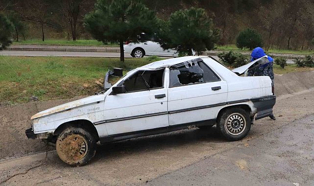 Takla atan otomobilden burnu bile kanamadan kurtuldu